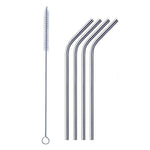 Bent stainless steel straw elegantly placed in a clear drinking glass.