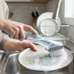 Refillable dish scrub brush with liquid soap inside