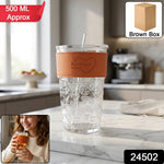 Transparent glass tumbler with lid and straw hole, ideal for cold beverages