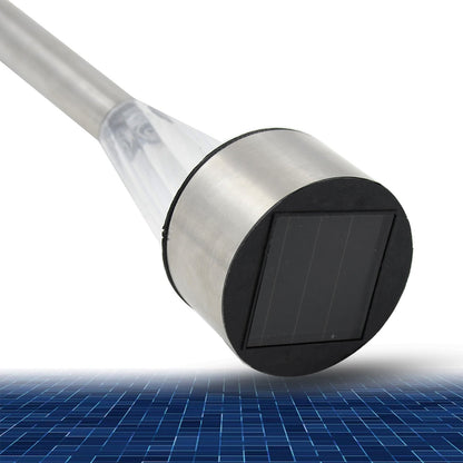 A single Solar LED Spike Light firmly planted in a lush green garden bed.