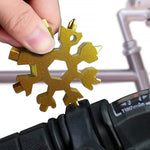 Close-up of the durable stainless steel Snowflake Multi-Tool, highlighting its intricate design.