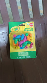 Pencil top erasers displayed in a retail packaging, highlighting the product.