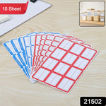 Multiple sheets of red and white self-adhesive label stickers stacked