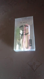 Close-up of multi-pin plastic wall hooks for secure hanging without drilling