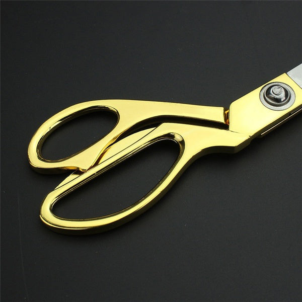 Durable gold-plated cloth cutting scissors demonstrating their robust construction.