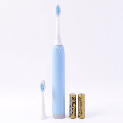 Electric sonic toothbrush on white background with extra head