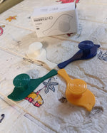 Close-up of a self-adhesive bird hook securely holding a small accessory.
