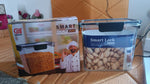 Stacked airtight plastic food storage containers with snap lids