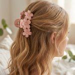 Model wearing large pink hair claw clip