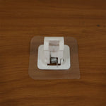 Self-adhesive towel rod holder providing space-saving bathroom storage