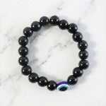 Detailed view of transparent crystal beads on elegant stretch bracelet