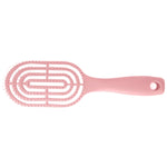 Detail of curved head and flexible bristles for scalp massage on hair brush