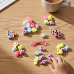 Close-up of colorful beads and charms in kids jewelry making kit