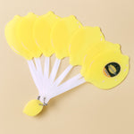 Foldable lemon-shaped hand fan closed in compact portable form