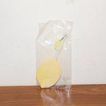 Lemon-shaped hand fan providing instant manual cooling and comfort