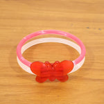 Glowing butterfly bracelet worn on wrist during night party