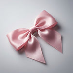 Satin hair bow clip showing smooth fabric and bow design for hair styling