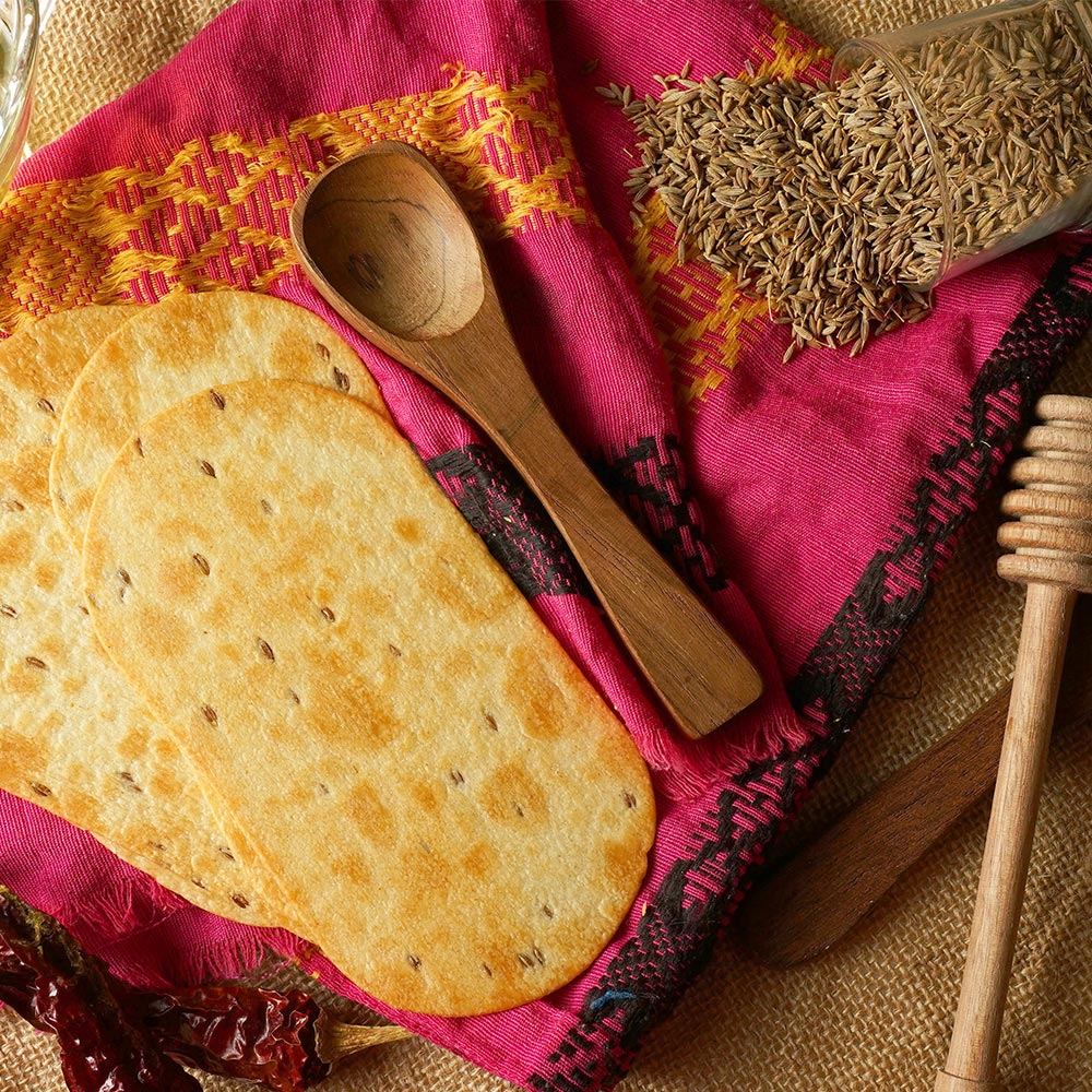 Close-up of baked wheat Khakhra, highlighting its thin and crispy texture.