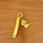 Colorful dinosaur keychain accessory hanging from backpack strap