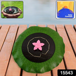 Floating solar water pump operating in pond displaying decorative water jet