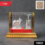 Sacred Kamdhenu cow and calf silver-plated idol with red velvet base