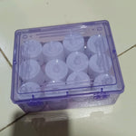 Arrangement of white LED tealight candles for elegant party and wedding settings.