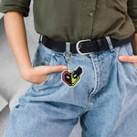 Close-up of pixel design cartoon acrylic keychain in bright retro colors