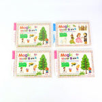 Child’s hand revealing colours on magic water activity book with water pen