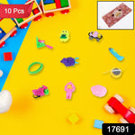 Close-up of several small, colorful activity toys from the 10-in-1 set, including a puzzle and whistle.