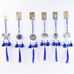 Detailed view of evil eye metal bell wind chime for house protection